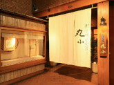 株式会社丸小本店（本格肉料理　丸小）